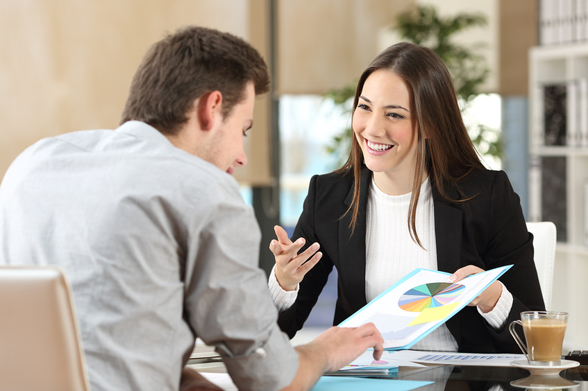 Woman discussing documents with a customer.